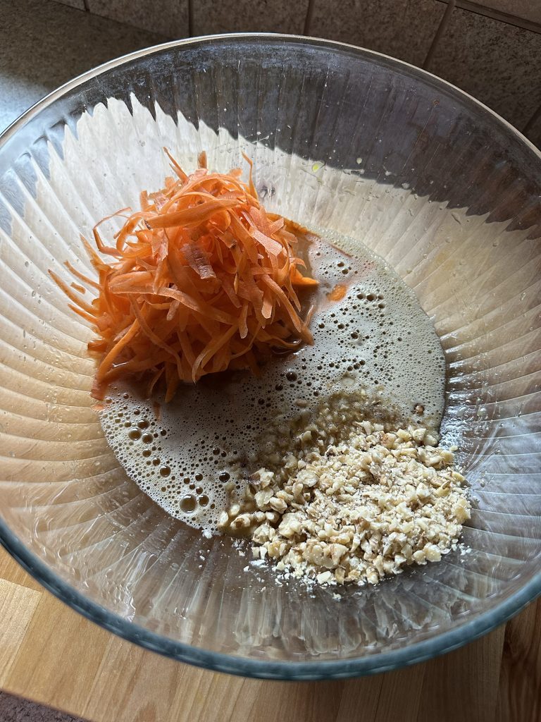 Freshly-Milled Whole Wheat Carrot Cake Muffins in a bowl unmixed