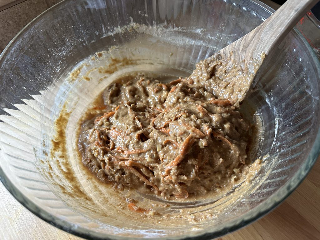 Freshly-Milled Whole Wheat Carrot Cake Muffins all mixed in glass bowl