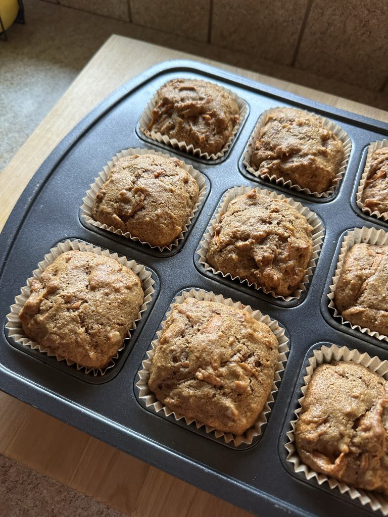 Freshly-Milled Whole Wheat Carrot Cake Muffins fully baked in a tin